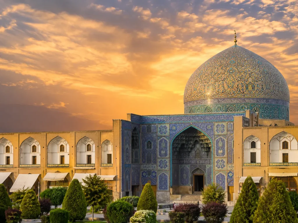 Sheikh Lotfollah Mosque in Isfahan at golden hour with detailed blue tilework