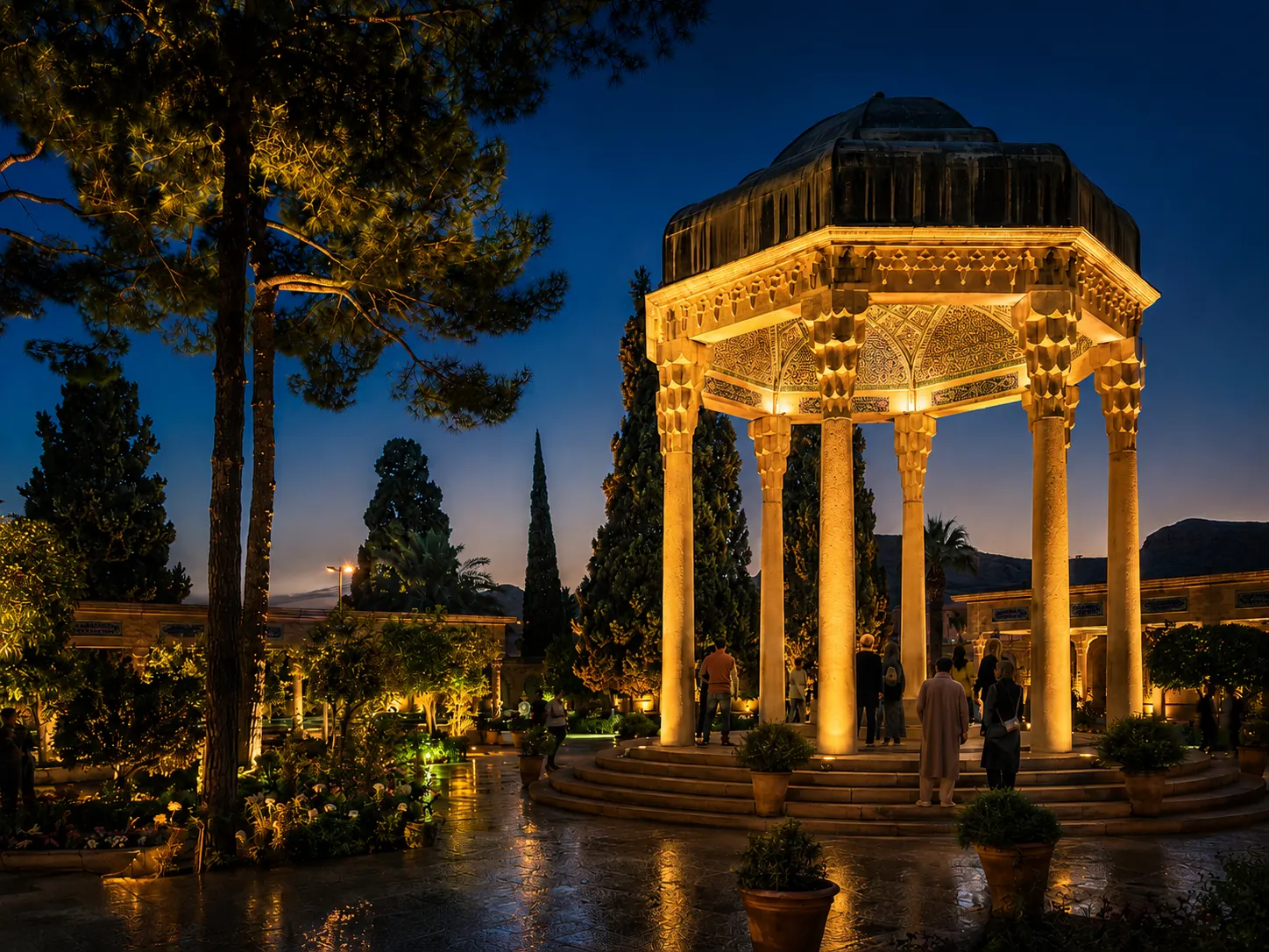 Tomb of Hafez in Shiraz illuminated at evening in a peaceful Persian garden