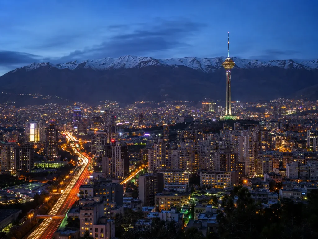 Tehran skyline with Milad Tower and the Alborz Mountains at dusk, Iran